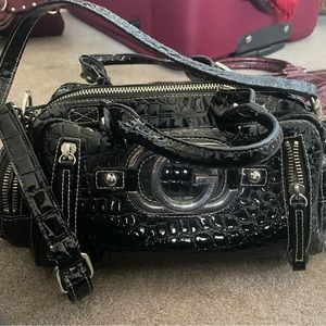 A vintage black guess purse
